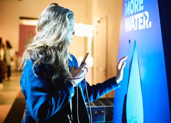 Woman in front a screen Drink more water